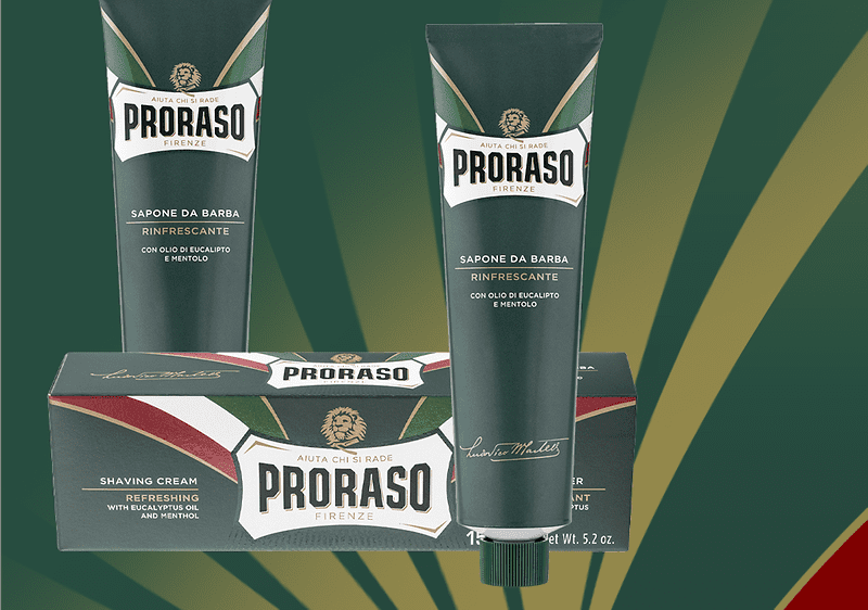 Tub și cutie de cremă de ras Proraso pe fundal verde și galben