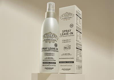 Spray leave-in și cutie produs Alfaparf pe fundal bej