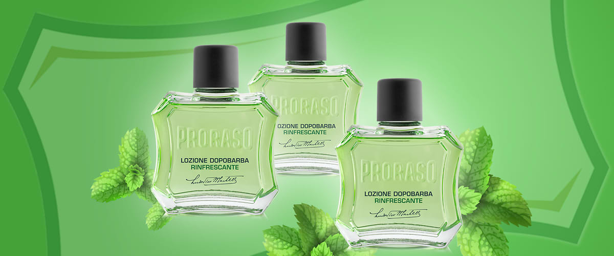 Trei sticle de aftershave Proraso pe fundal verde cu frunze de mentă