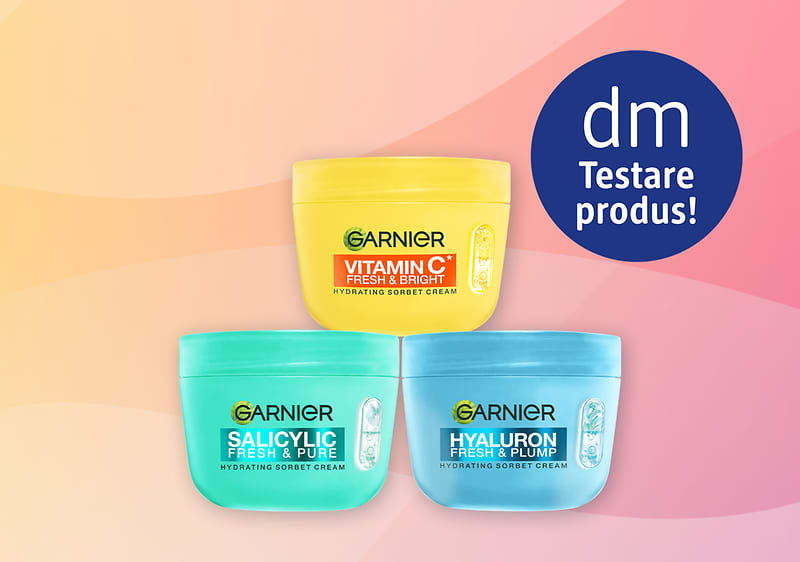 Garnier cremă Vitamin C, Salicylic și Hyaluron pe fundal roz-portocaliu cu siglă dm Testare produs