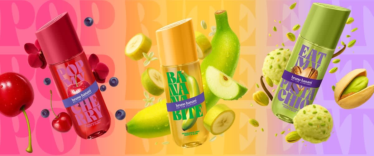 Spray deodorant verde pentru brandul Bruno Banani cu text mare „EAT PISTACHIO” pe etichetă, înconjurat de fistic întreg și feliat și biluțe cremoase de fistic pe fundal degradat mov-galben