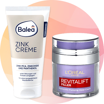 Balea Zink Creme a L'Oréal Revitalift Filler krém na farebnom pozadí