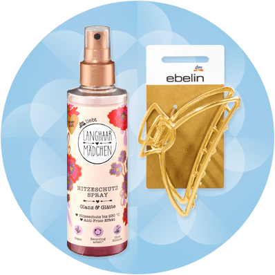 Sprej na vlasy a zlatá spona na vlasy na modrom pozadí