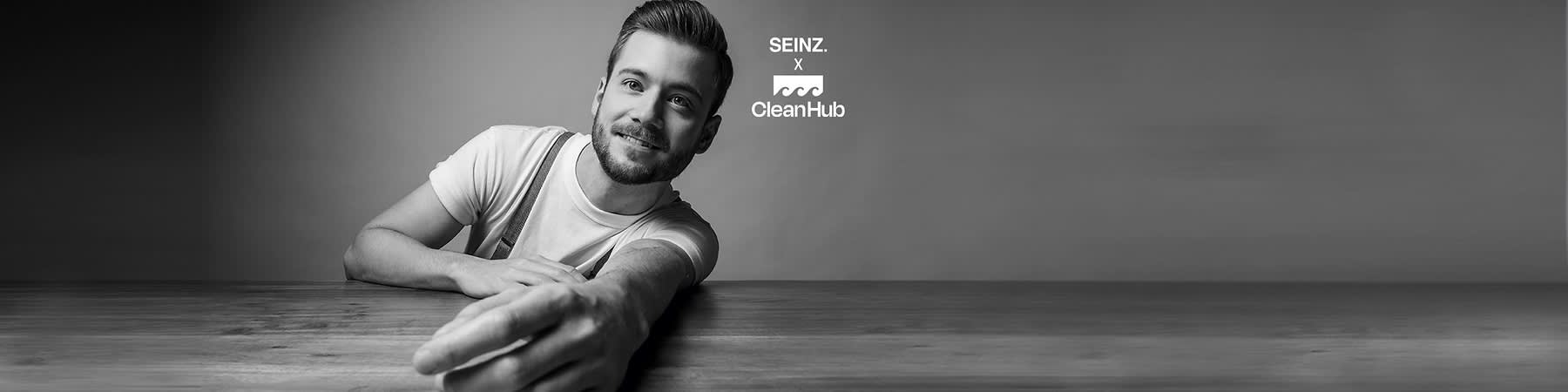 muž a logo SEINZ. v spoluvpráci s CleanHub