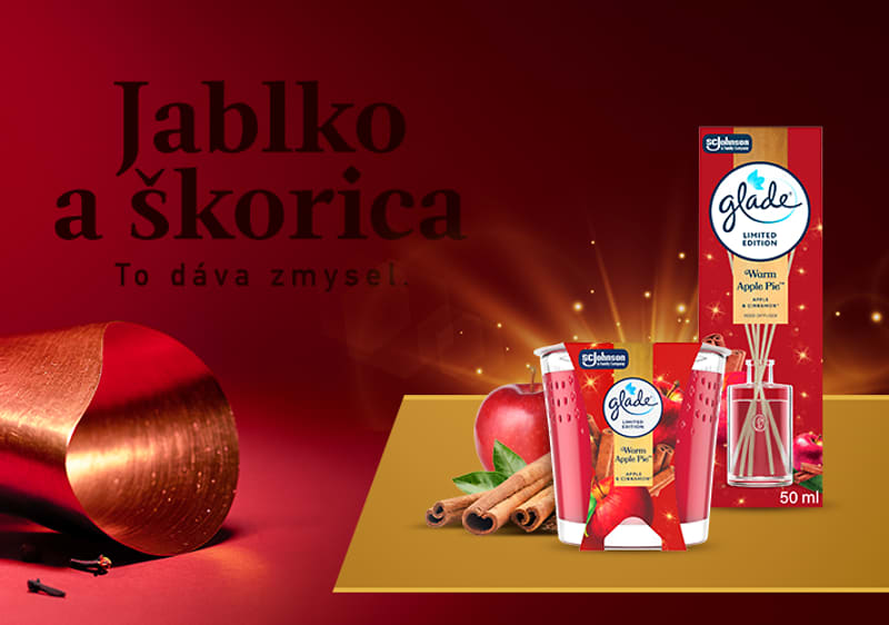 Jablko a škorica s osviežovačom vzduchu glade na červenom pozadí