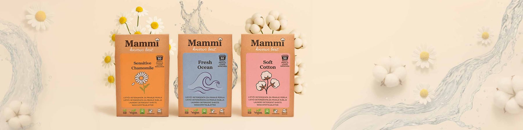 Alt-Text Tri škatle pralnega praška Mammi z motivi kamilice, oceana in bombaža