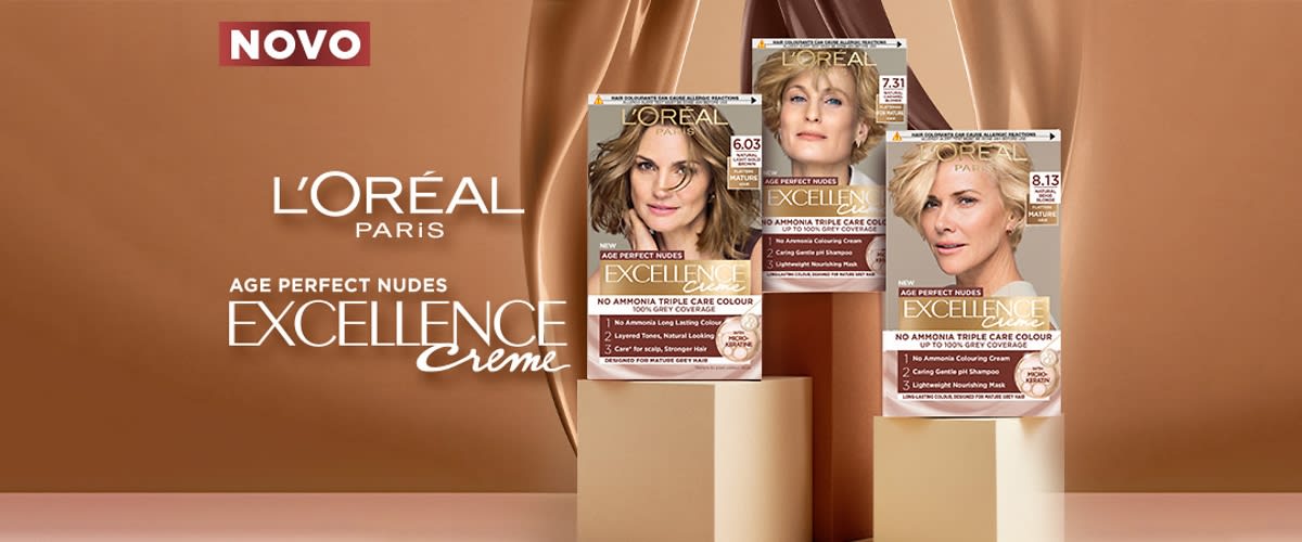 Embalaža barve za lase L'Oréal Excellence creme z več škatlami na rjavem ozadju