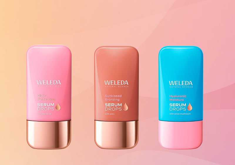 Alt-Text Weleda Skin Food krema za dnevno in nočno nego na zeleni podlagi
